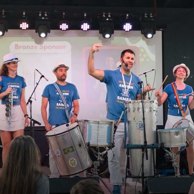 Samba Percussion Experience — Austin Samba performing live on stage with surdo and repinique drums at Brazil Day ATX