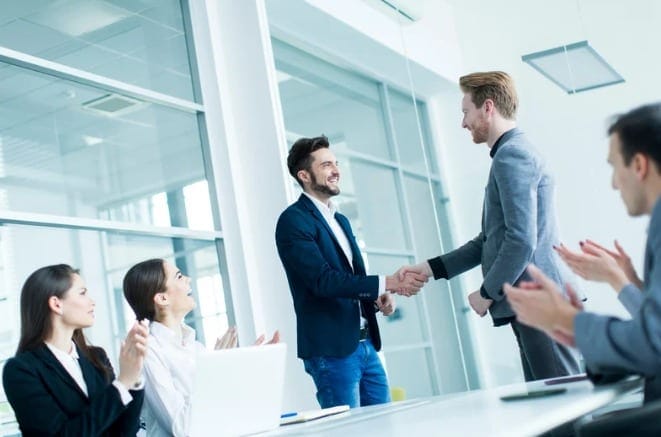 Professionals shaking hands at a networking event